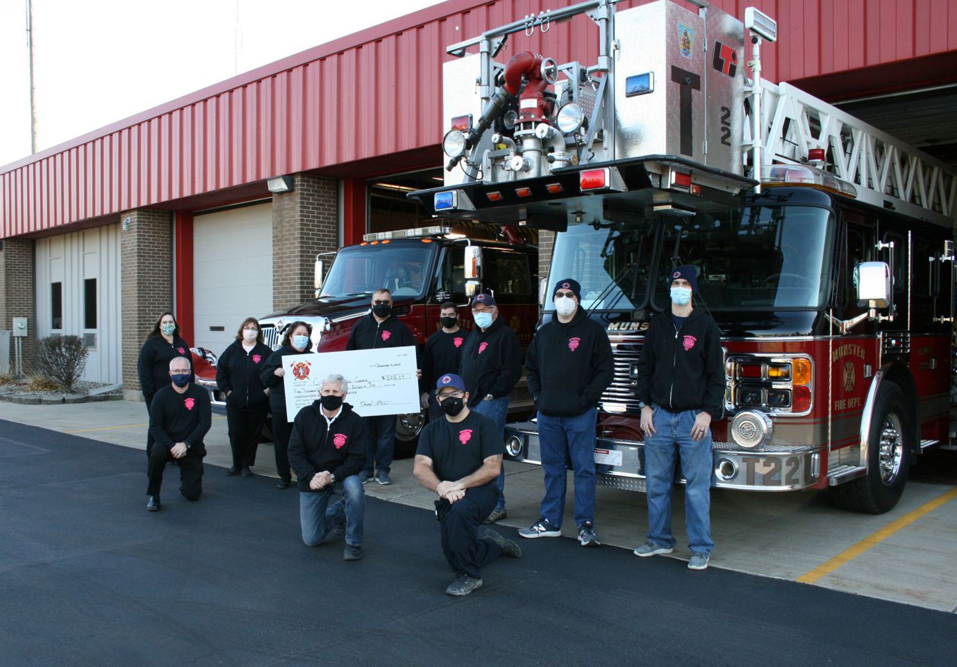 Some of the Munster Firefighters/Association members who sold t-shirts to raise funding for the Cancer Resource Centre and were at the check presentation include (left to right) Vita Ayala (Cancer Resource Centre), Anthony Andello (Cancer Resource Centre), Roxy Propeck (Community Cancer Research Foundation), Marie Macke (Community Cancer Research Foundation), Fire Chief Dave Pelc, Deputy Fire Chief Dave Strbjak, Bill Nyhanna, Jonathan Fabian, Rick Herman Jr., Ben Mecyssine and Ryan Abens.